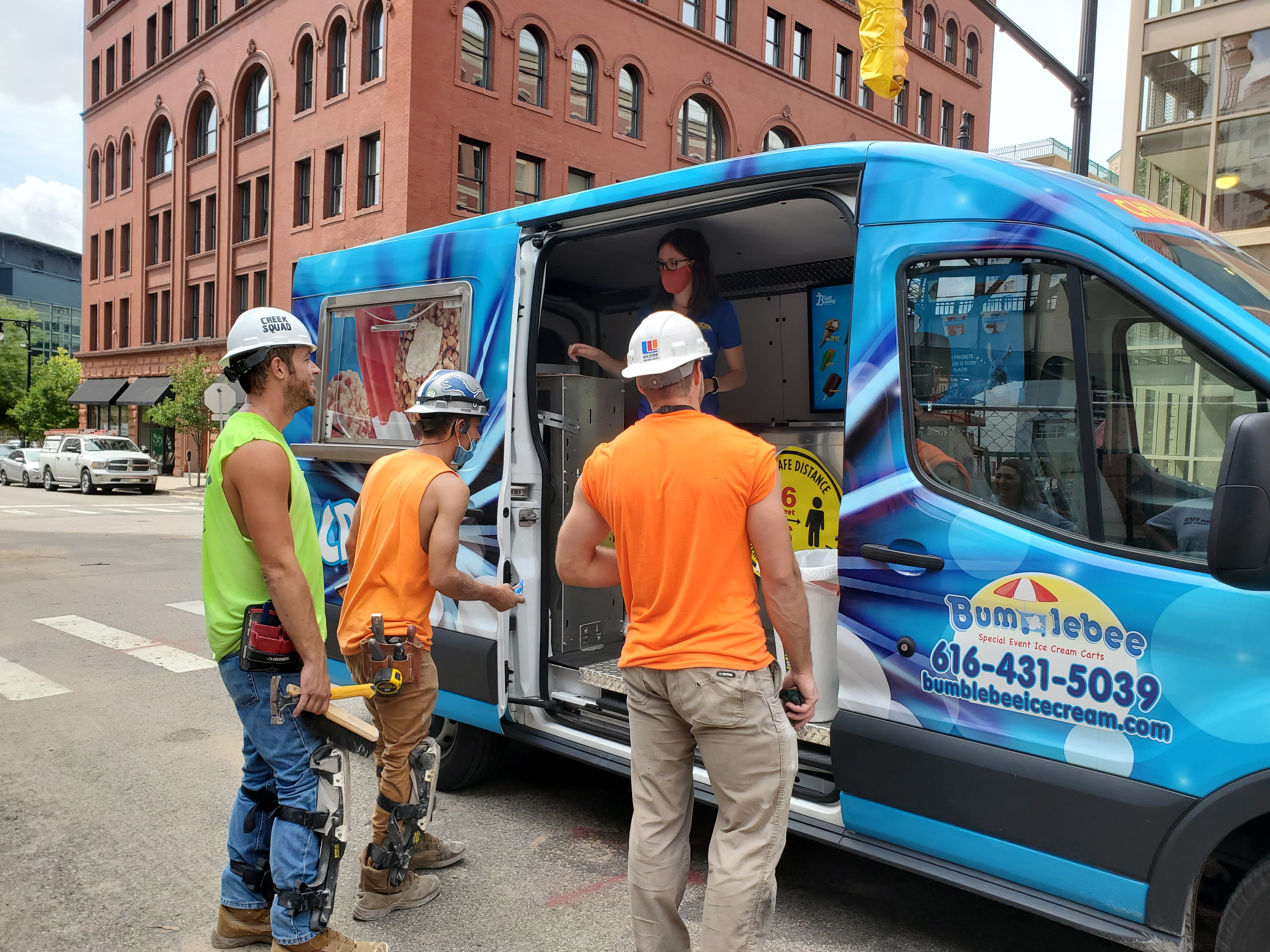 Surprising construction workers with an ice cream truck on a hot day.