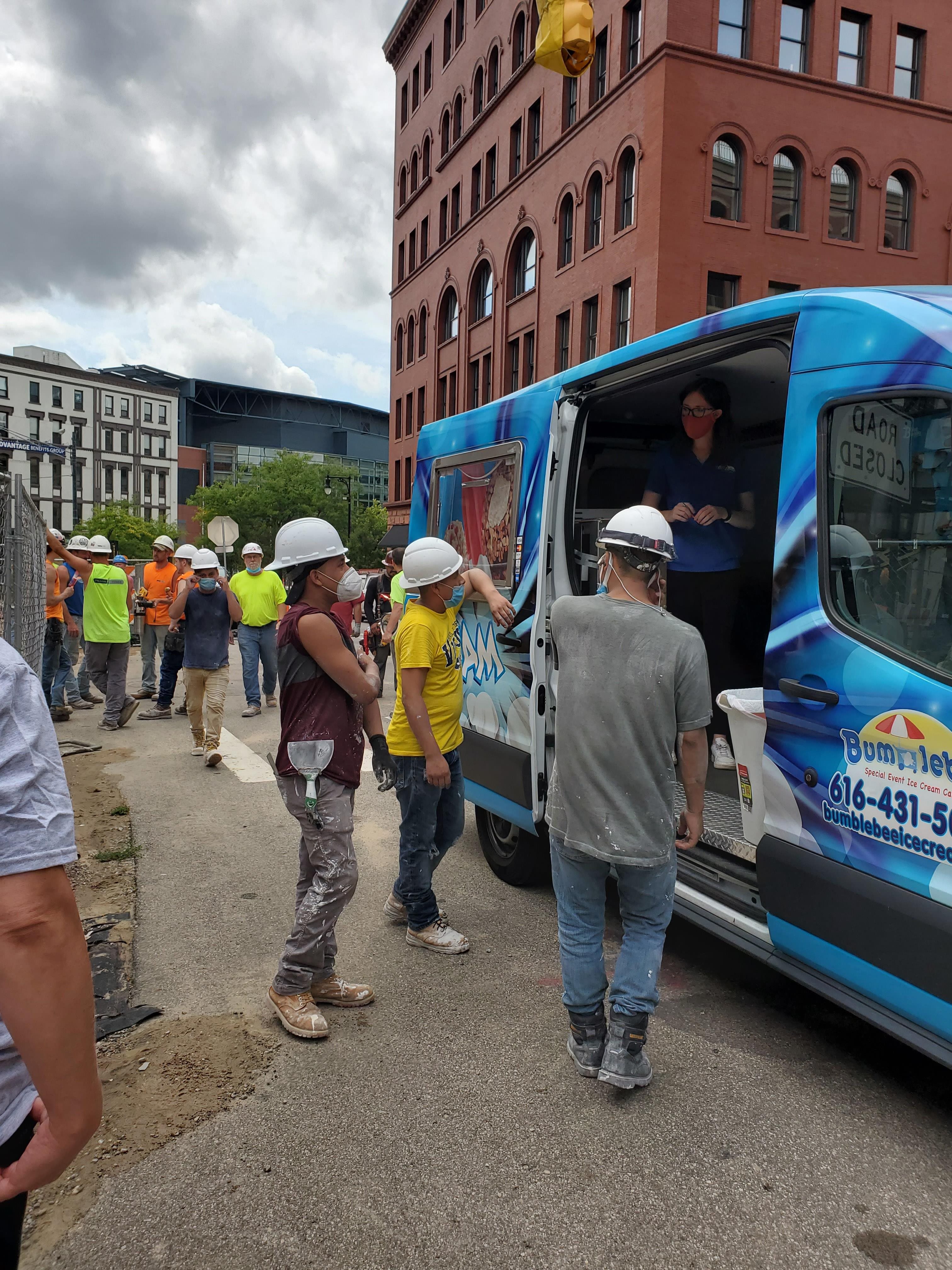 Surprising construction workers with an ice cream truck on a hot day.